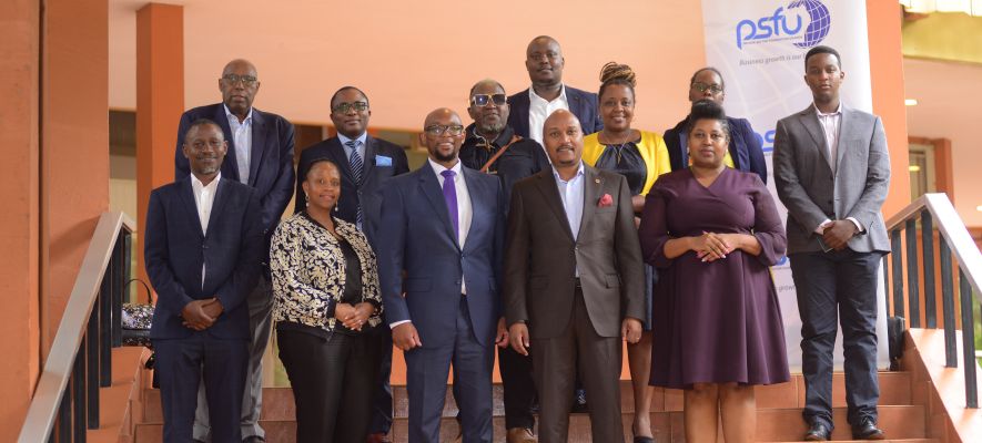 The Head of the South African Delegation Mr. Andile Ramophosa (in a purple tie) poses for a group picture with the Board and Management of PSFU at Kampala Serena Hotel on Monday, September 12, 2023.